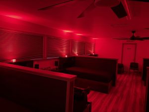 Shared fire station bunk room lit red by EaseAlert wireless alert lighting